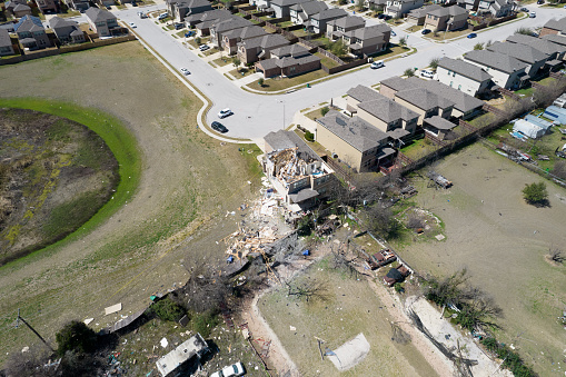 Aerial drone views of Tornado Path after extreme weather natural disaster destroys homes across Austin , Texas , USA