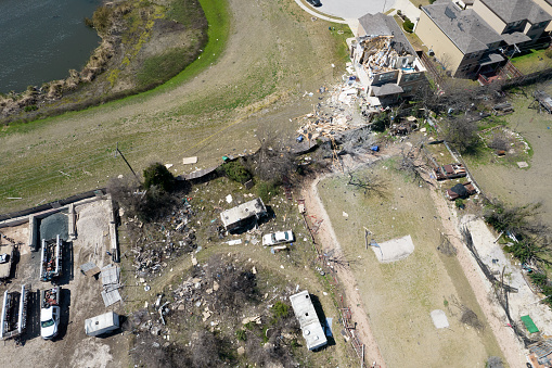 Aerial drone views of Tornado Path after extreme weather natural disaster destroys homes across Austin , Texas , USA