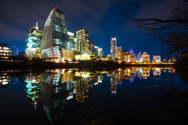 Mirrored reflection of a Perfect colorful Austin Texas Skyline Cityscape reflecting off Lady Bird Lake or Colorado River with glowing capital cities city lights