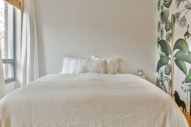 istock A spacious bedroom with a large white bed 1388097615