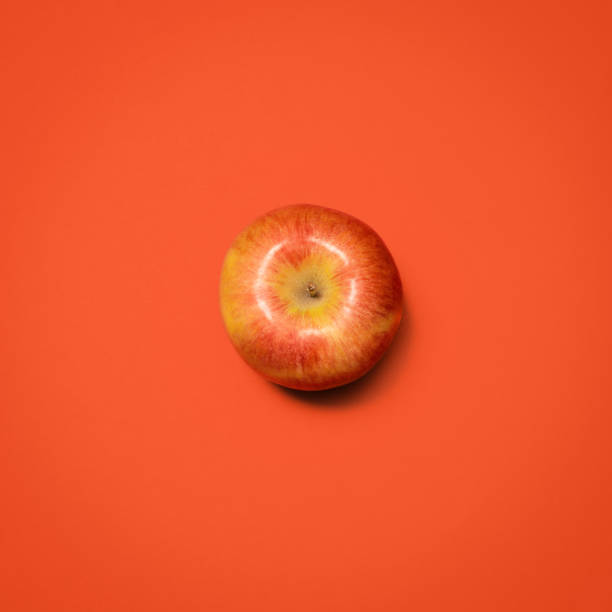istock Shot of a red apple against an empty studio background 1388102370