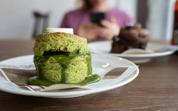 Photo of Close up of Matcha scone served on plate.