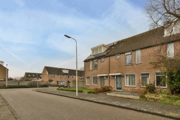 istock A small residential brick house with a lawn 1388102639