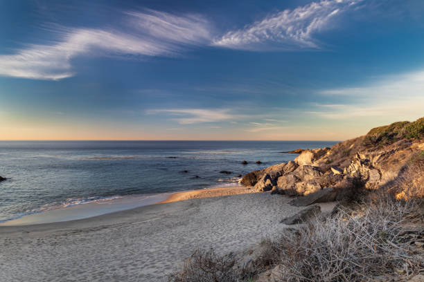 istock Sandy beach, calm ocean. Blue sky and clouds 1388103947