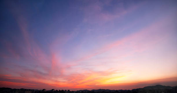 istock Beautiful sunset sky and clouds 1388105412