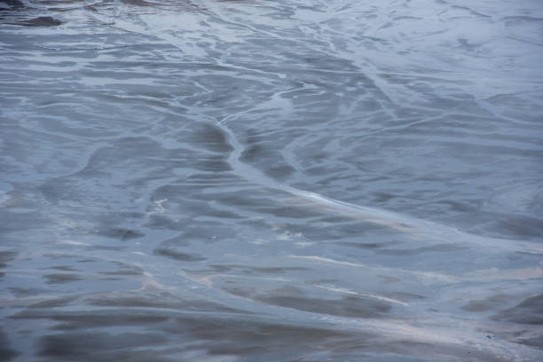 istock Muddy waters in a decantation pond. Toxic residuals from a copper mine decating in a settling basin 1388109064