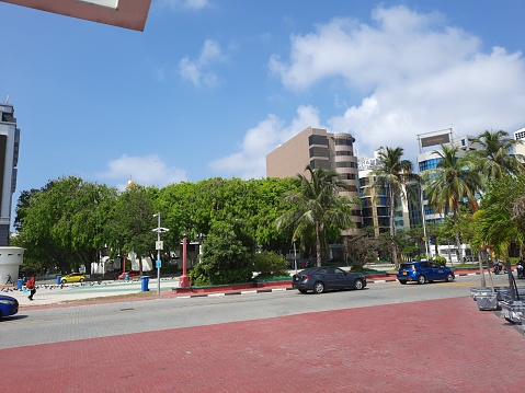 Day View of the business centers of the Maldives capital Male. Male is the capital and largest commercial center of the Maldives.  It's known for its mosques and colorful buildings.   Because of the capital and the big city, the shops are full of tourists.