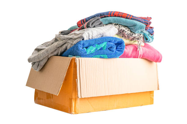 istock Donation box with used clothes isolated on white background with clipping path to support help for poor people in the world. 1388110053