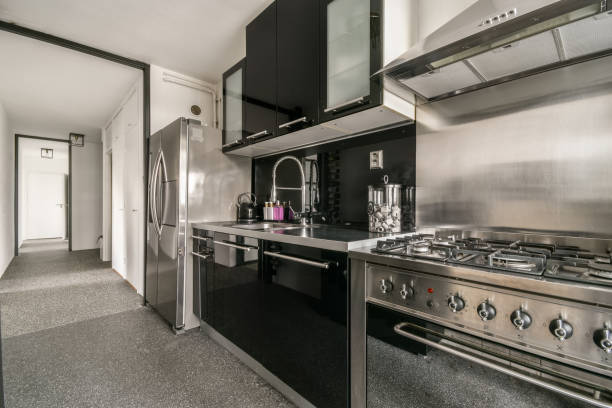 istock Kitchen in dark colors with modern appliances and 1388111218