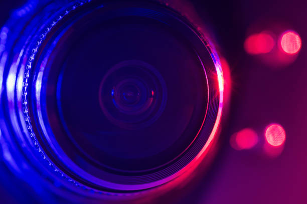 istock Camera lens with purple and blue backlight. Optics. Cyberpunk style 1388111698