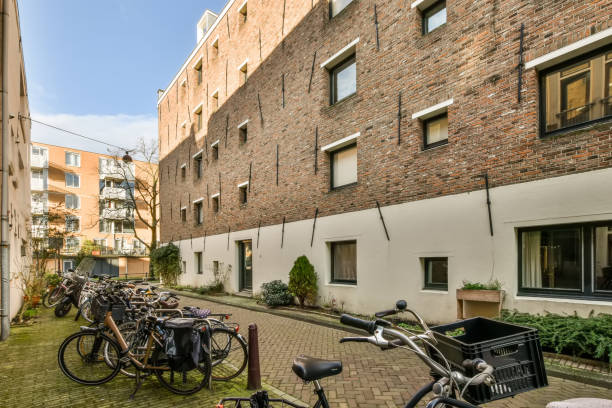 istock Multi-storey residential building with windows of various formats 1388111790