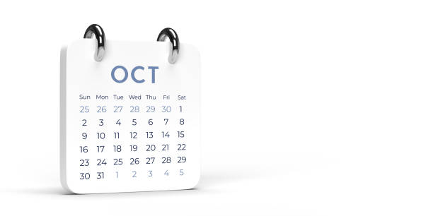 Red October 2019 calendar on brown reflective wood surface. Horizontal composition with copy space. Calendar and reminder concept with selective focus.