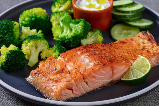 istock roast salmon fillet with boiled broccoli and sauce 1388116324