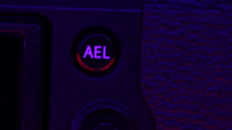 Macro shot of camera buttons, optical wheel. DSLR or mirrorless photography, videography device. Switching mode of still to movie.