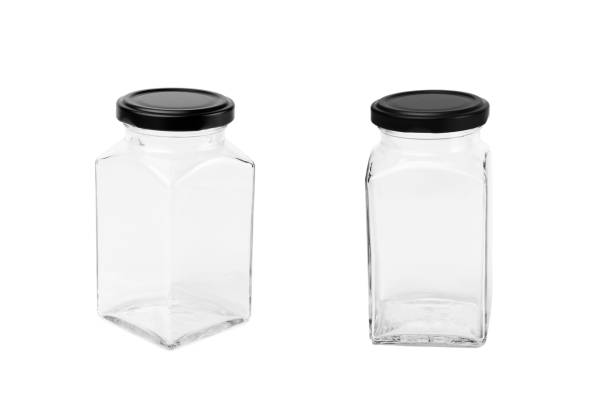 istock Empty glass jar with black lid isolated on a white background 1388116900