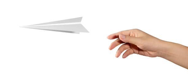 istock Hand throwing paper plane isolated on white background. concept new innovation and creativity. 1388117823