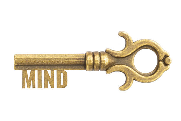 Realistic bronze vintage antique key with word Mind isolated on white background
