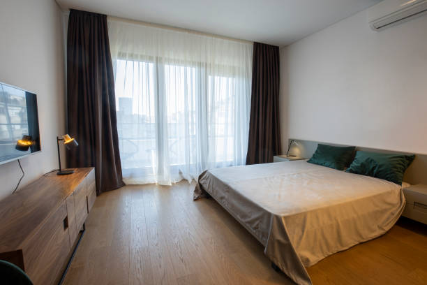istock Interior of a bedroom with large master bed 1388125400