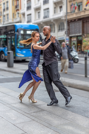 Madrid, Spain. March 9 2022. Multiracial dance couple dancing in Madrid\