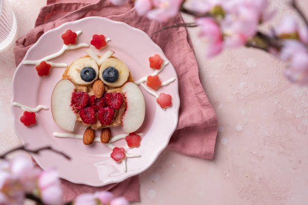 Owl pancakes with fruits for kids breakfast