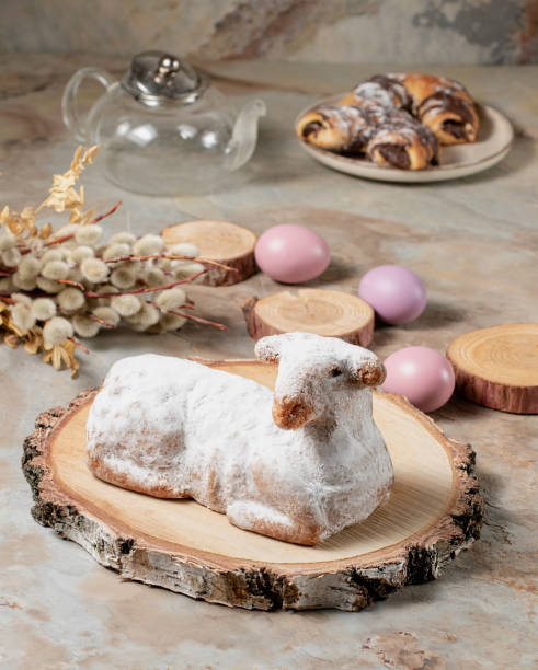istock Traditional easter sweet lamb cake with powdered sugar, willow, eggs, teapot, wood, baking and sack 1388129384