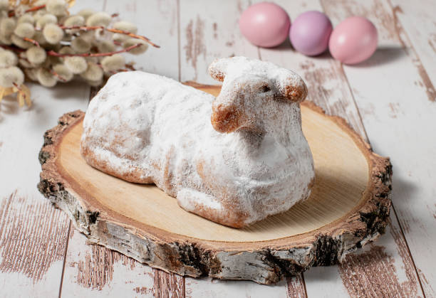 istock Traditional easter sweet lamb cake with powdered sugar, willow and eggs 1388129385