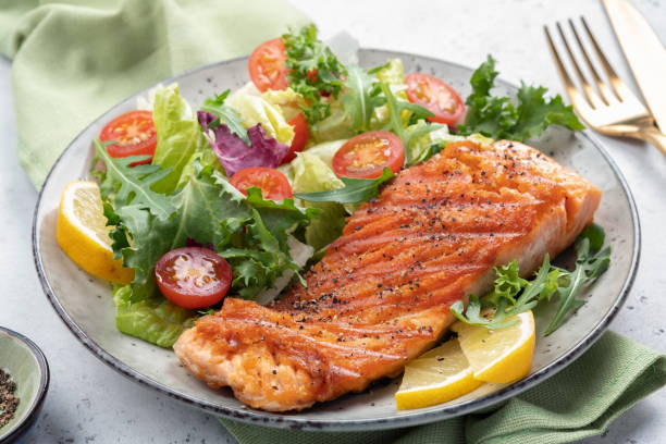 istock Grilled salmon and fresh salad 1388129765