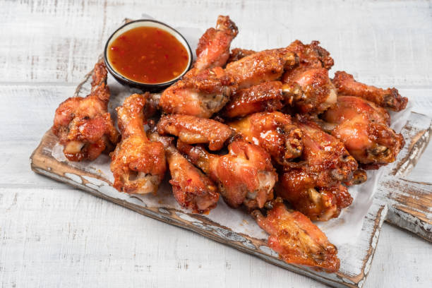 istock Chicken wings with sriracha sauce 1388129786