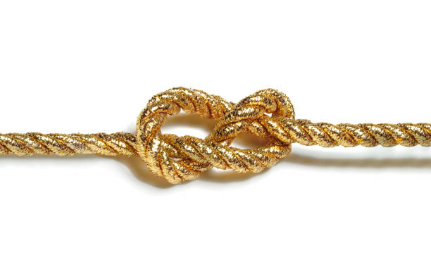 istock golden rope with nautical knot isolated on white 1388129966