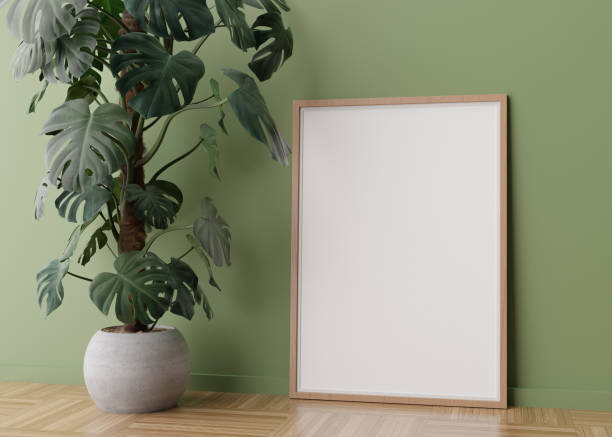 istock Empty vertical picture frame standing on parquet floor in modern living room. Mock up interior in minimalist, scandinavian style. Free space for picture. Monstera plant. 3D rendering. 1388131161