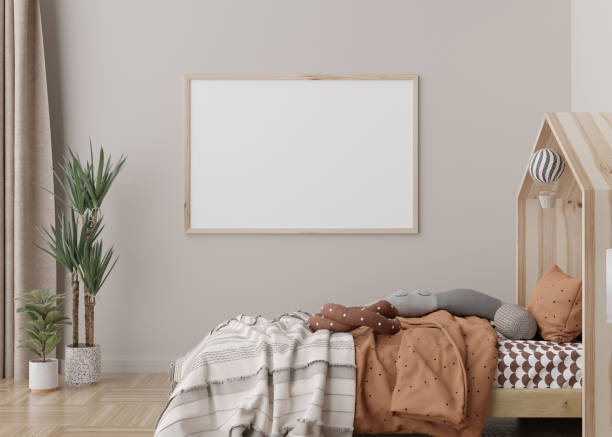 istock Empty horizontal picture frame on cream wall in modern child room. Mock up interior in scandinavian style. Free, copy space for your picture, poster. Bed, toys. Cozy room for kids. 3D rendering. 1388131164