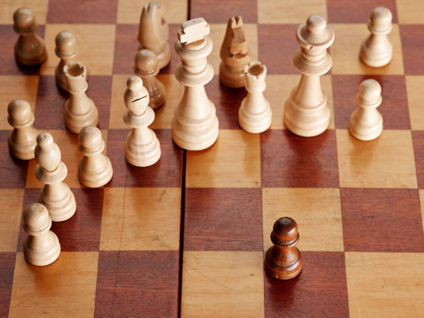 istock Pawn chess piece surrendered or trapped in the corner by the white team. 1388133701