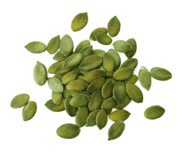 istock Peeled pumpkin seeds isolated on white, top view 1388136388