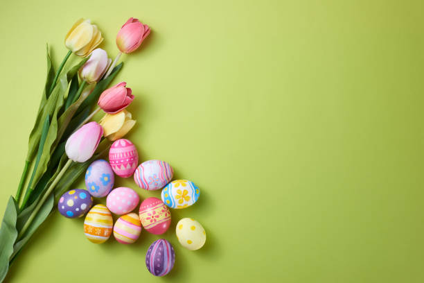 istock Happy Easter day colorful eggs and flower on paper background with copy space 1388136802