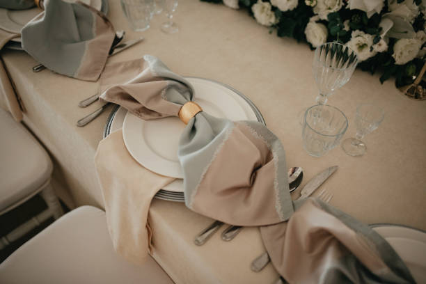 istock Decoration with fresh flowers, candles, light bulbs, garlands. Vintage style. Table setting for an event party or wedding reception. Event decorations. 1388137076