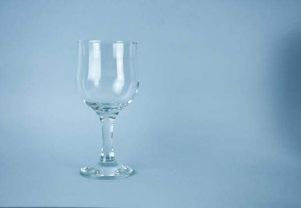 istock wine glass on a blue background 1388137287