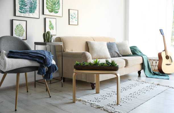 istock Stylish living room interior with comfortable sofa, chair and plaids 1388138285