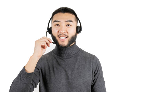 istock Young asian man call center operator isolated on white background 1388139239