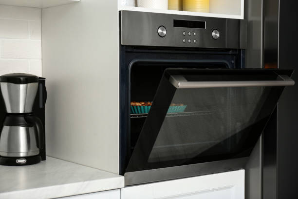 istock Delicious fresh homemade cake in modern oven 1388140339