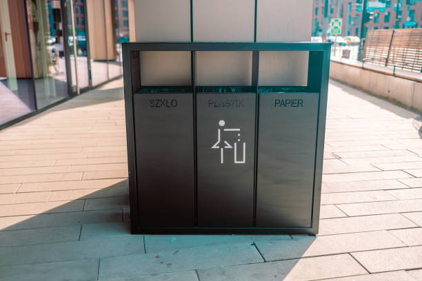 istock recycling and garbage concept. Modern trash container for metal, glass and plastic waste sorting on city street 1388142279