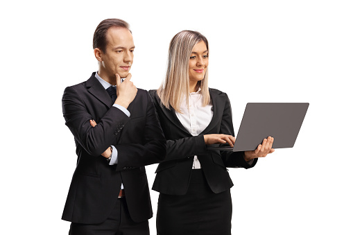 Businesswoman holding on a laptop computer and a businessman looking and thinking isolated on white background