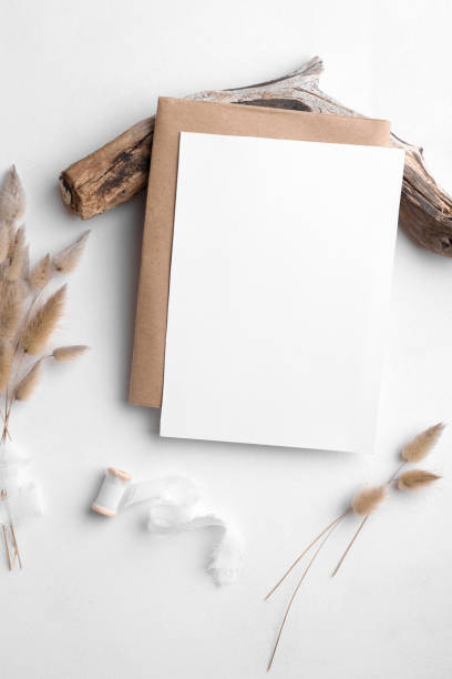 istock Wedding stationery invitation card mockup 5x7 on white background with envelop and boho decor, vertical card 1388146766