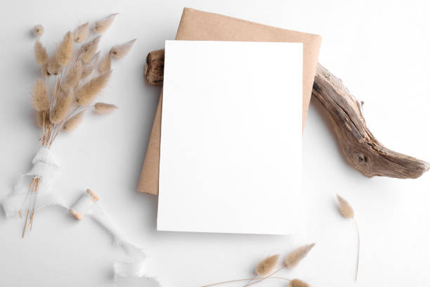 istock Wedding stationery invitation card mockup 5x7 on white background with envelop and boho decor, vertical card 1388146770