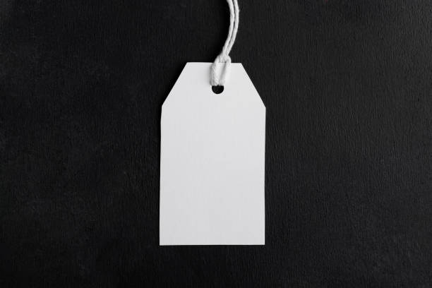 istock Blank paper rectangular price tag mockup isolated on black background, Sale and black friday concept 1388147101
