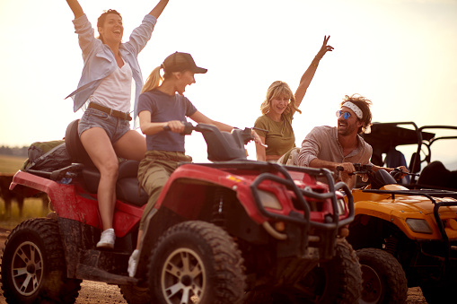 People  driving quad bikes at the mountains on journey