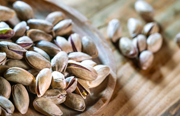 istock salt roasted pistachio on wooden table 1388148353