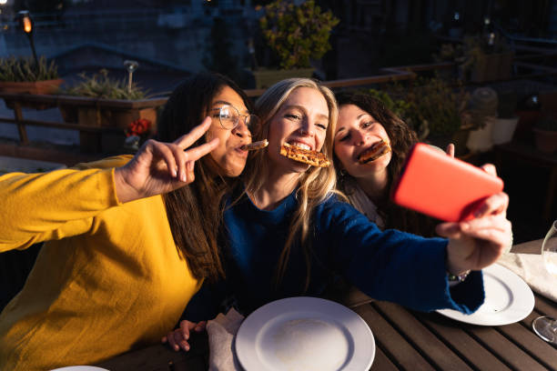 istock Female Friends Taking Selfie 1388148673