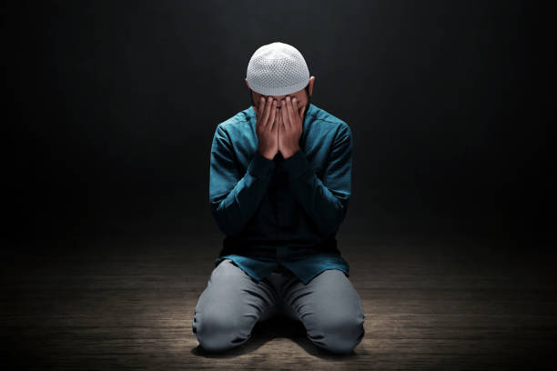 istock Muslim man praying in the mosque 1388150895