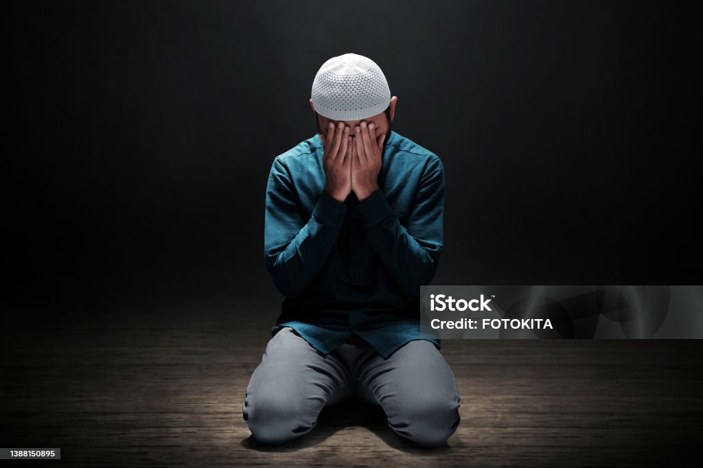 Muslim man praying in the mosque Islam Stock Photo