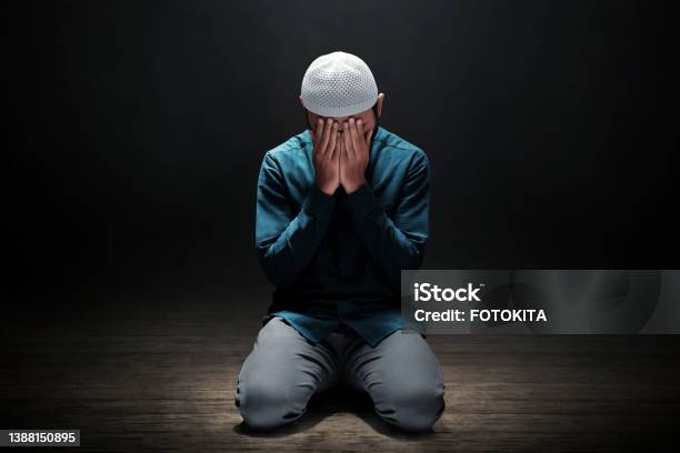 Muslim Man Praying In The Mosque Stock Photo - Download Image Now - Islam, Praying, Sadness